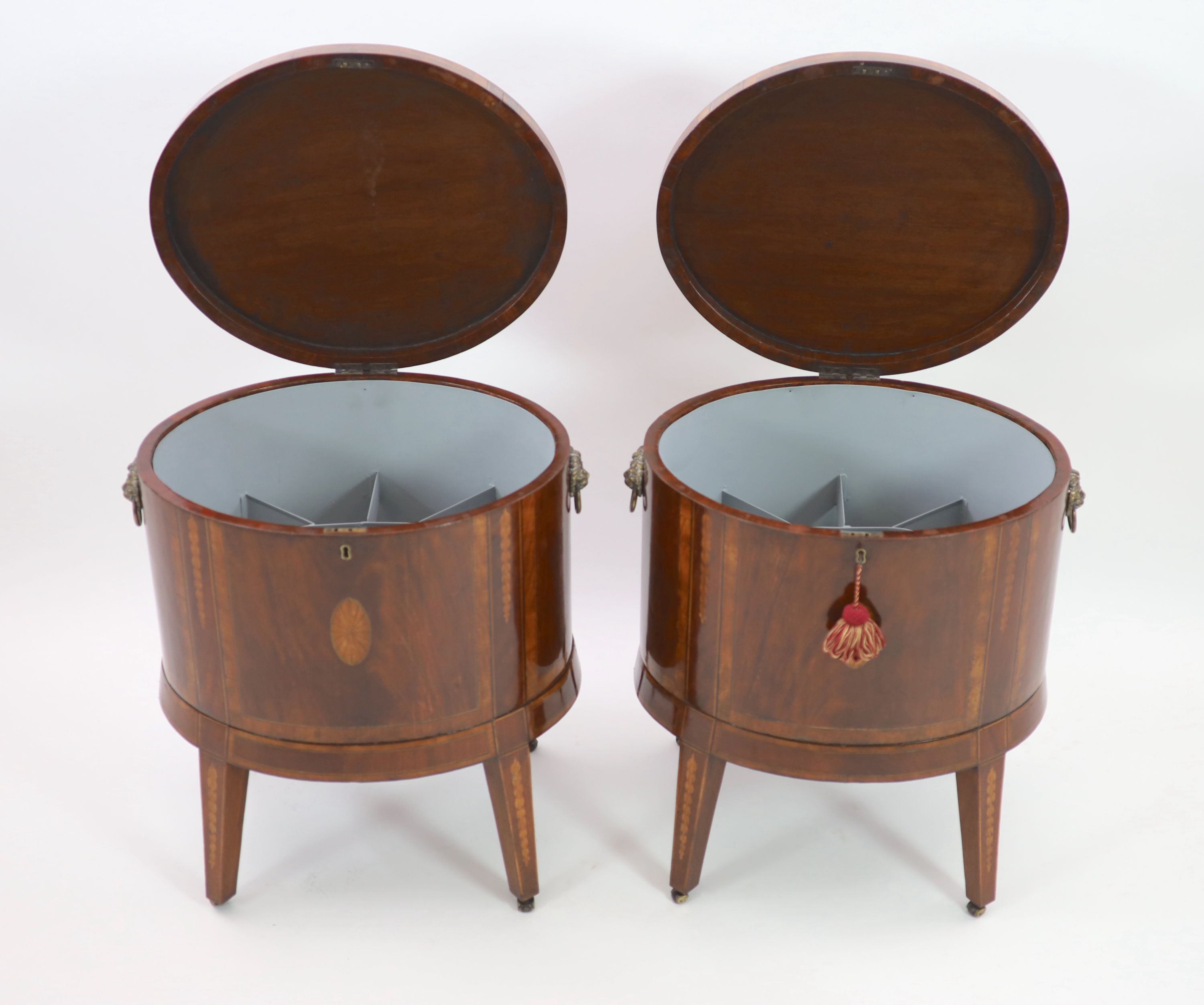 A pair of George III Sheraton style oval inlaid mahogany cellarets, W.64cm D.46cm H.68cm